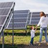 mother with her little son by solar panels, solar panels |